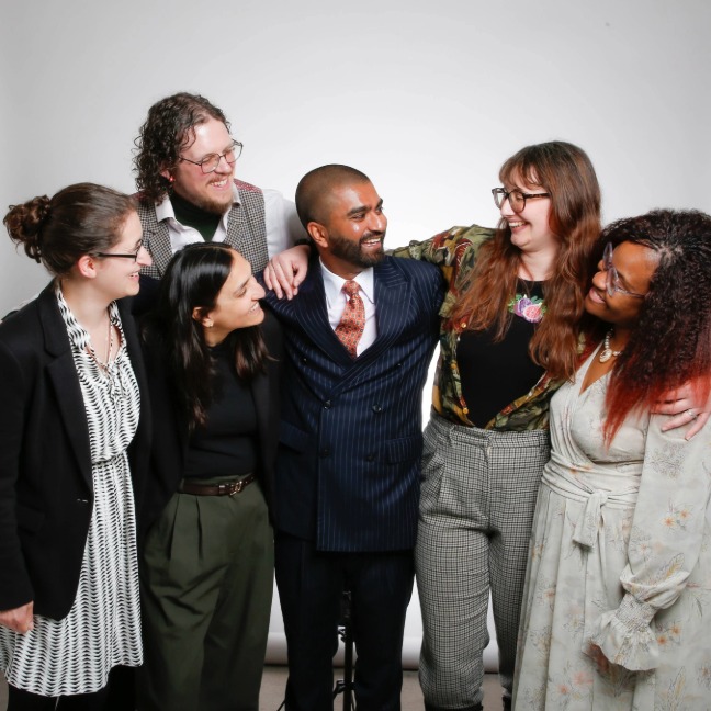 Group of members hugging and laughing with each other