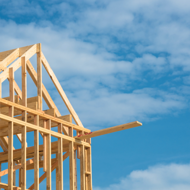 Building the foundations of a house against a blue sky