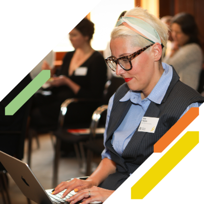 Woman types on laptop