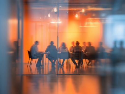 People sitting around in a boardroom meeting