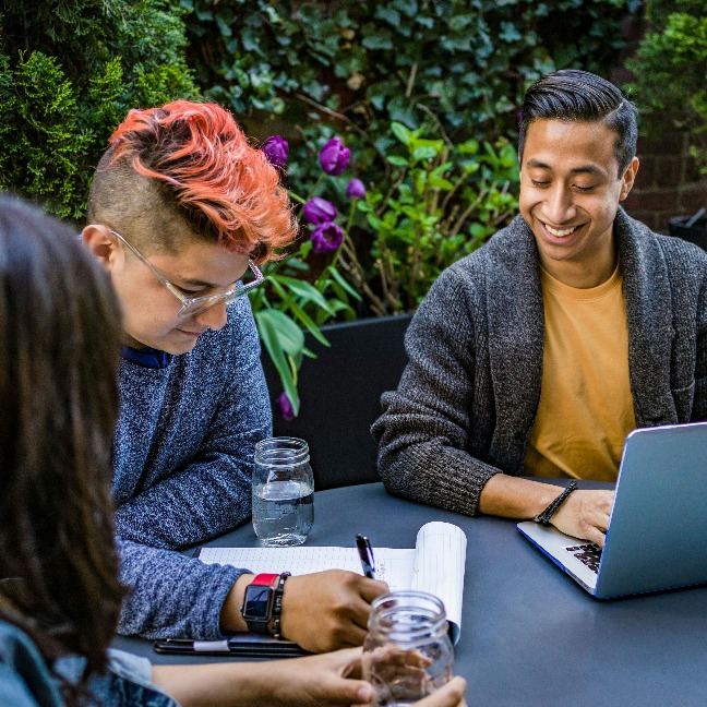 Group of early career researchers working together around a table