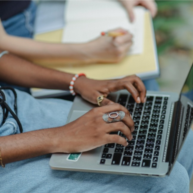 Someone typing on a computer