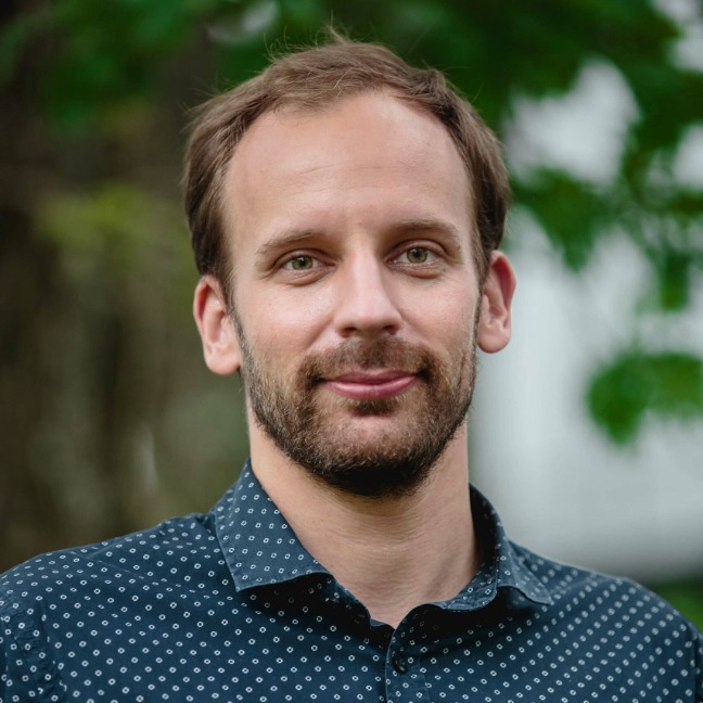 Gergely Toldi smiles at camera