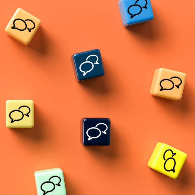 Dice showing speech bubbles