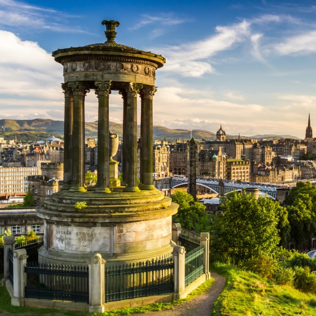 Carlton Hill in Edinburgh with a big statue in foreground overlooking city