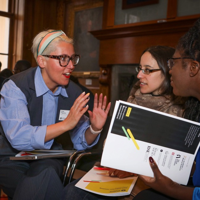 Members discuss together at a meeting