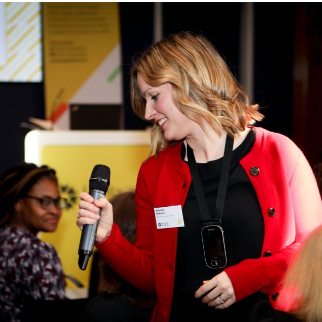 A member has the microphone during a meeting