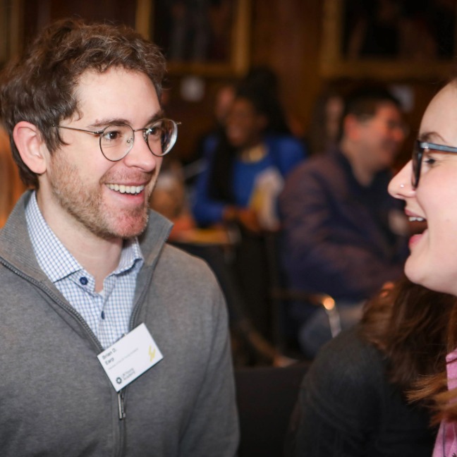 Members discuss together at a meeting