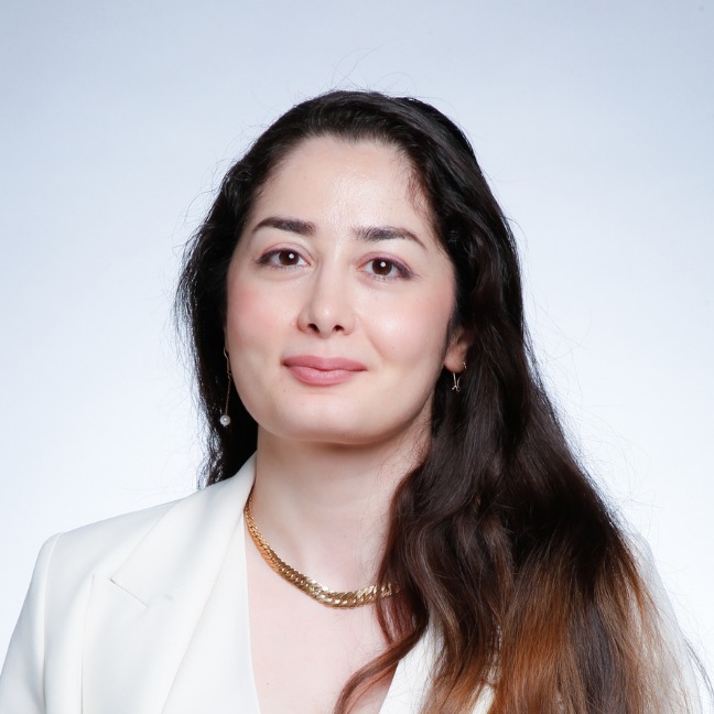 Fatemeh smiles at the camera