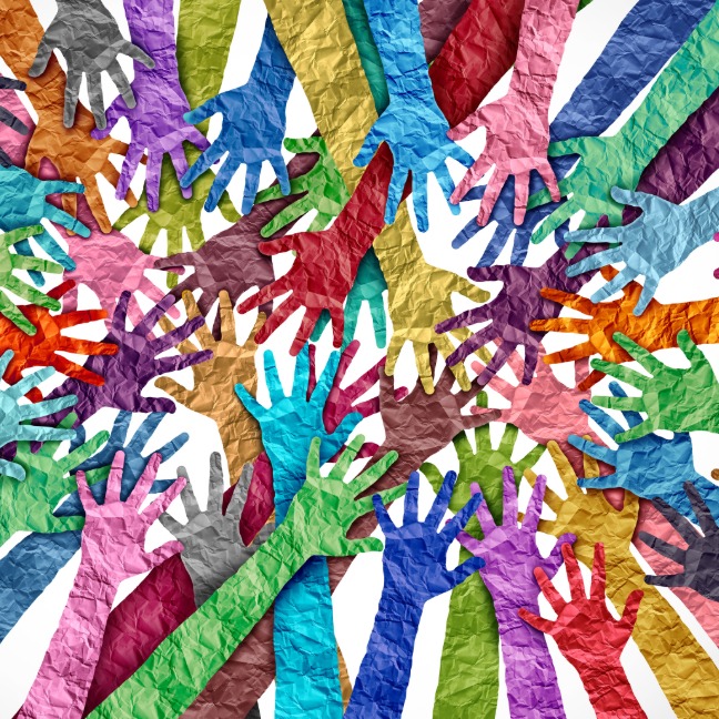 Many hands in different colours joining the circle