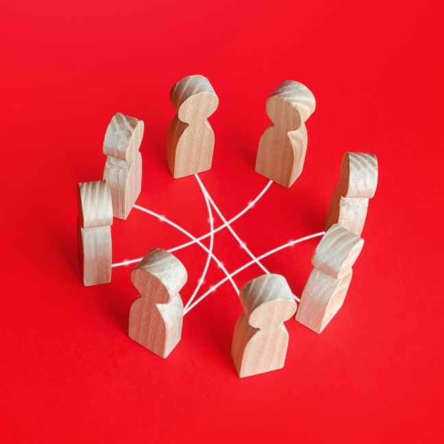 Group of 8 wooden figures standing in a circle connected by lines.