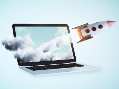 Rocket seen launching from a laptop screen into the real world.