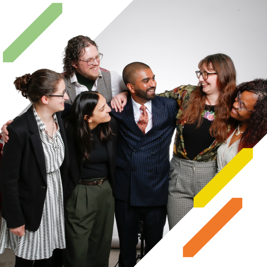 Six people stand together with their arms around one another during a group photograph. Decorative green, yellow, and orange graphic elements frame the image.