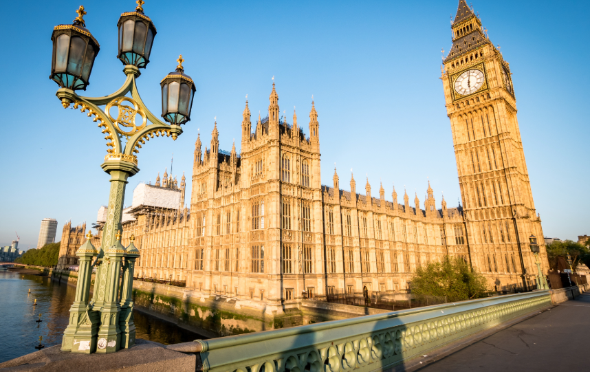 The Palace of Westminster and Elizabeth Tower (Big Ben) beside the River Thames in London, representing the UK Parliament, government and national policymaking.